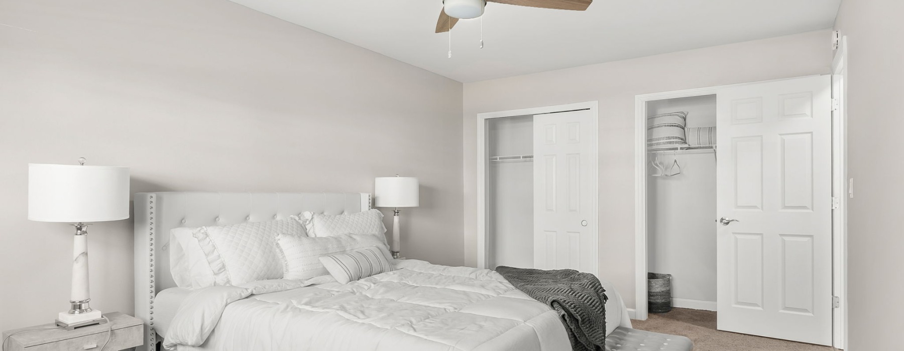 bedroom with bed ceiling fan and lamp
