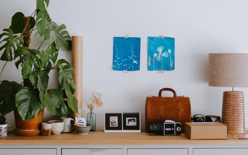 large dresser with a variety of decor on it